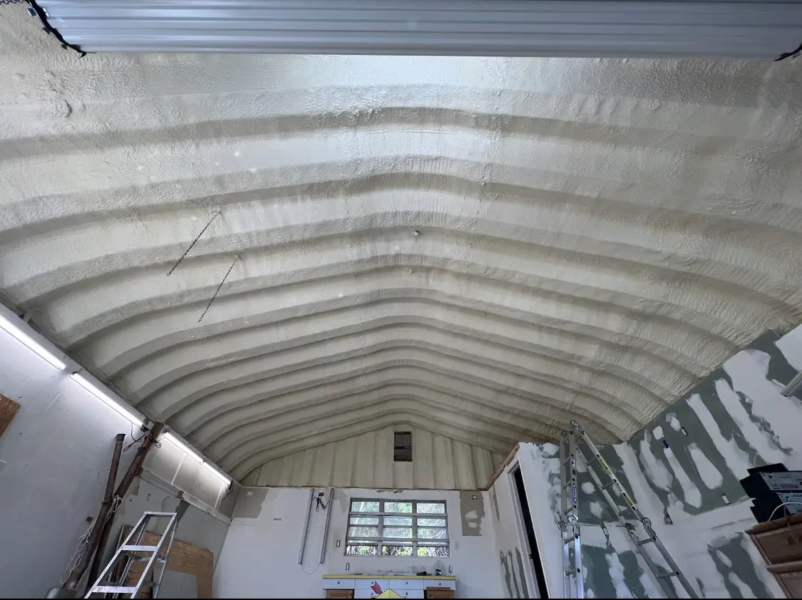 Spray polyurethane foam applied to the underside of a metal roof deck in Cibolo